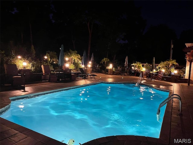 651 Kiefer Creek Rd, Ballwin, MO 63021 - pool at twilight featuring a patio area and an outdoor pool