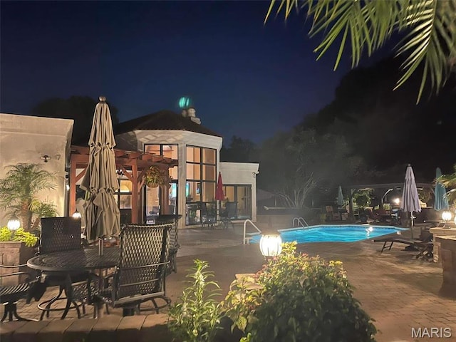 651 Kiefer Creek Rd, Ballwin, MO 63021 - pool at twilight featuring a patio area and a community pool