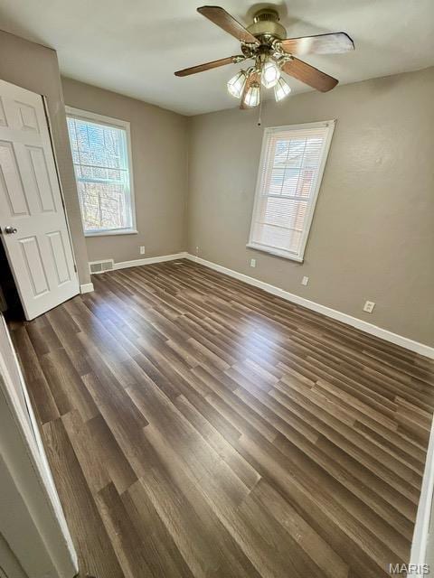 19 S Schlueter Ave, Saint Louis, MO 63135 - unfurnished bedroom with dark wood-style floors and a ceiling fan