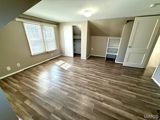 19 S Schlueter Ave, Saint Louis, MO 63135 - bonus room featuring baseboards and dark wood-style floors