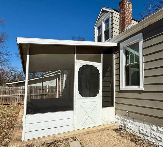 19 S Schlueter Ave, Saint Louis, MO 63135 - property entrance featuring a chimney