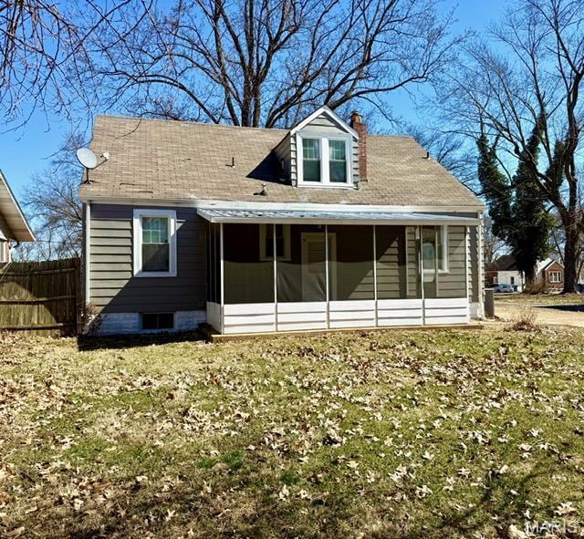 19 S Schlueter Ave, Saint Louis, MO 63135 - rear view of property featuring a sunroom and a chimney