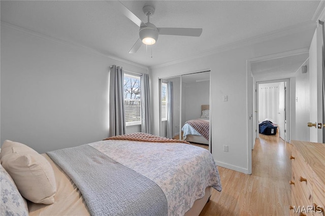 13419 Land O Woods Dr Unit 6, Saint Louis, MO 63141 - bedroom with ornamental molding, light wood-type flooring, a closet, baseboards, and a ceiling fan