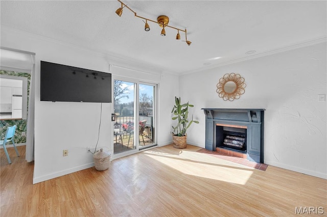13419 Land O Woods Dr Unit 6, Saint Louis, MO 63141 - unfurnished living room with wood finished floors, a fireplace with flush hearth, baseboards, and crown molding
