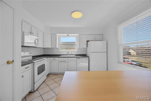 13419 Land O Woods Dr Unit 6, Saint Louis, MO 63141 - kitchen with white appliances, dark countertops, a sink, ornamental molding, and light tile patterned flooring