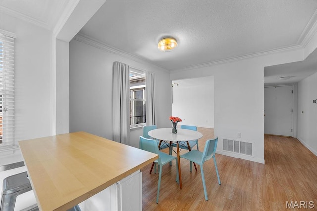 13419 Land O Woods Dr Unit 6, Saint Louis, MO 63141 - dining room with light wood-type flooring, ornamental molding, and baseboards
