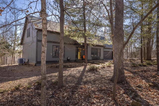 back of property with central AC