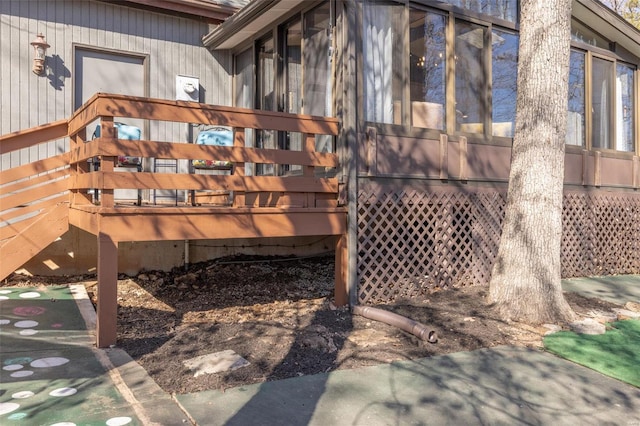 view of home's exterior with a sunroom