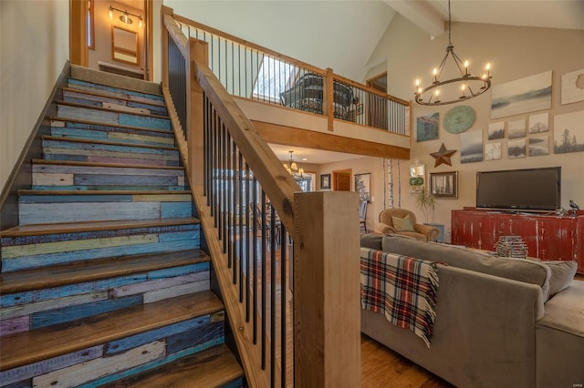 stairway with a chandelier, high vaulted ceiling, wood finished floors, and beamed ceiling