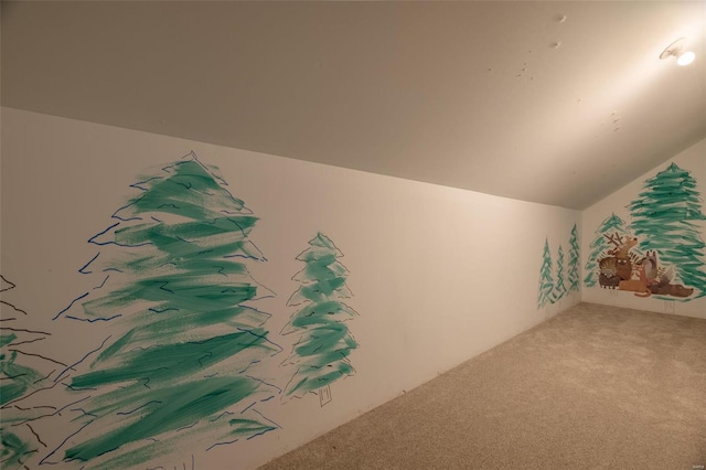 additional living space featuring carpet floors and lofted ceiling