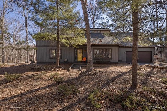 566 Aspen View Dr, Innsbrook, MO 63390 - rear view of house featuring an attached garage and dirt driveway