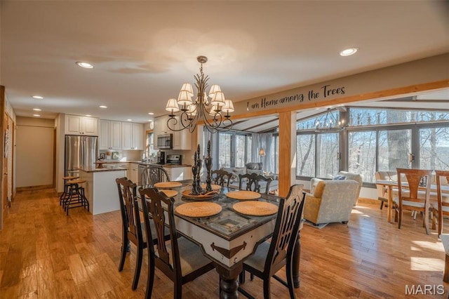 566 Aspen View Dr, Innsbrook, MO 63390 - dining area with a chandelier, light wood finished floors, and recessed lighting