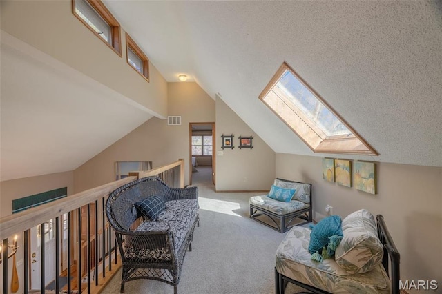566 Aspen View Dr, Innsbrook, MO 63390 - living area featuring a skylight, carpet floors, and vaulted ceiling