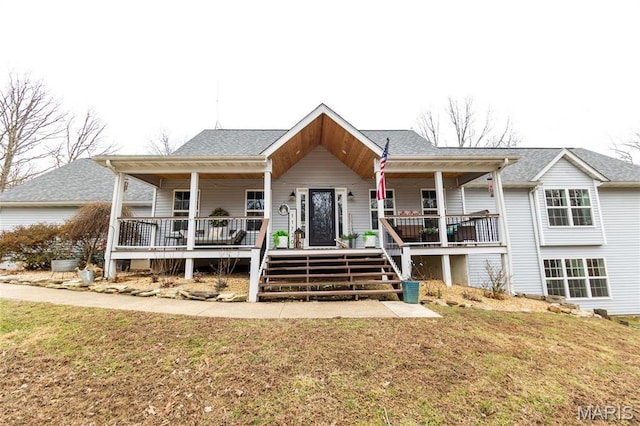 11720 County Road 5160, Rolla, MO 65401 - view of front facade with covered porch, a front yard, and a shingled roof