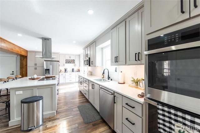 11720 County Road 5160, Rolla, MO 65401 - kitchen with island exhaust hood, a sink, stainless steel appliances, a kitchen breakfast bar, and a center island