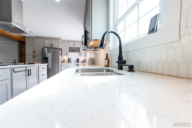 11720 County Road 5160, Rolla, MO 65401 - kitchen with stainless steel refrigerator with ice dispenser, extractor fan, a sink, gray cabinetry, and backsplash