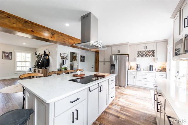 11720 County Road 5160, Rolla, MO 65401 - kitchen featuring stainless steel appliances, island exhaust hood, light wood-type flooring, light countertops, and recessed lighting