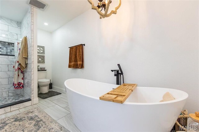 11720 County Road 5160, Rolla, MO 65401 - full bathroom with toilet, tiled shower, a freestanding tub, marble finish flooring, and baseboards
