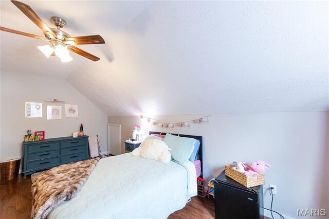 11720 County Road 5160, Rolla, MO 65401 - bedroom featuring wood finished floors, vaulted ceiling, and a ceiling fan