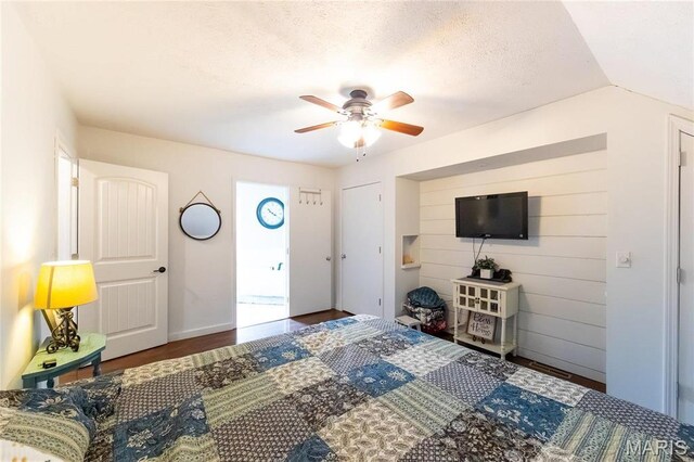 11720 County Road 5160, Rolla, MO 65401 - bedroom with wood finished floors, ceiling fan, a textured ceiling, and baseboards