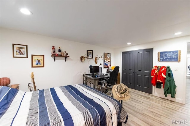 11720 County Road 5160, Rolla, MO 65401 - bedroom featuring wood finished floors, a closet, recessed lighting, and a desk