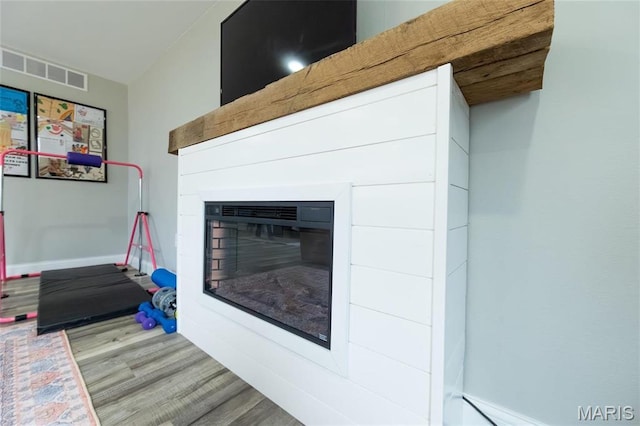 11720 County Road 5160, Rolla, MO 65401 - detailed view of wood finished floors and a glass covered fireplace