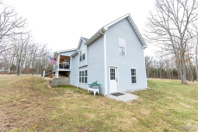 11720 County Road 5160, Rolla, MO 65401 - view of side of property with a lawn