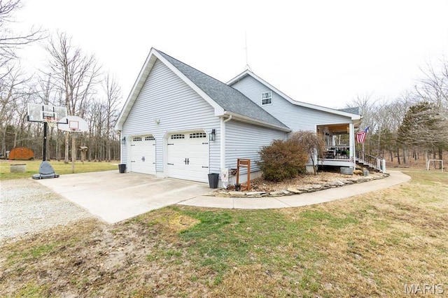 11720 County Road 5160, Rolla, MO 65401 - view of home's exterior featuring concrete driveway, a lawn, covered porch, and roof with shingles