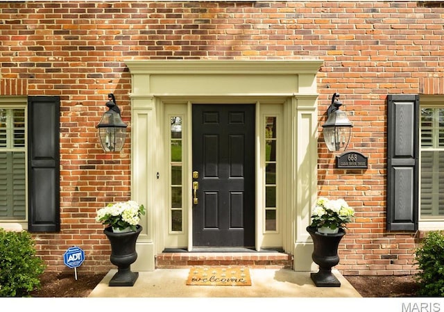 668 Clear Brook Dr, Des Peres, MO 63122 - doorway to property featuring brick siding