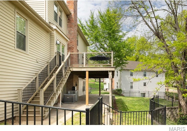 668 Clear Brook Dr, Des Peres, MO 63122 - view of yard with stairway, a deck, a patio, and central air condition unit