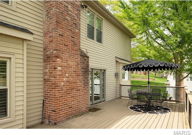 668 Clear Brook Dr, Des Peres, MO 63122 - wooden terrace featuring outdoor dining area
