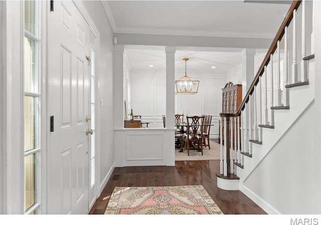 668 Clear Brook Dr, Des Peres, MO 63122 - entrance foyer with dark wood finished floors, stairway, crown molding, a chandelier, and baseboards