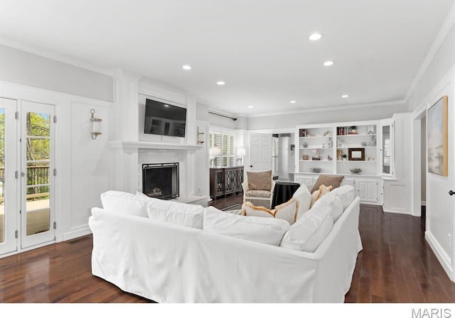 668 Clear Brook Dr, Des Peres, MO 63122 - living room featuring crown molding, dark wood-style floors, plenty of natural light, a fireplace with raised hearth, and recessed lighting