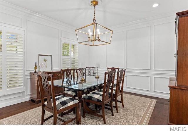668 Clear Brook Dr, Des Peres, MO 63122 - dining room featuring a decorative wall, dark wood finished floors, a chandelier, crown molding, and recessed lighting