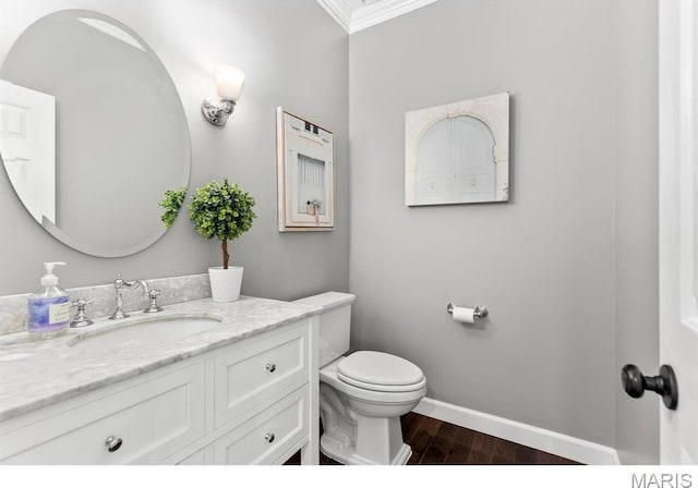 668 Clear Brook Dr, Des Peres, MO 63122 - bathroom with ornamental molding, vanity, toilet, wood finished floors, and baseboards