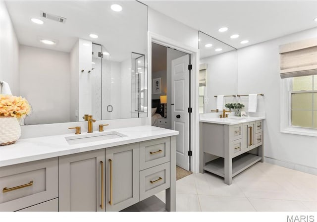 668 Clear Brook Dr, Des Peres, MO 63122 - bathroom featuring two vanities, a shower stall, recessed lighting, and tile patterned floors