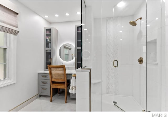 668 Clear Brook Dr, Des Peres, MO 63122 - bathroom featuring a shower stall, vanity, recessed lighting, and tile patterned floors