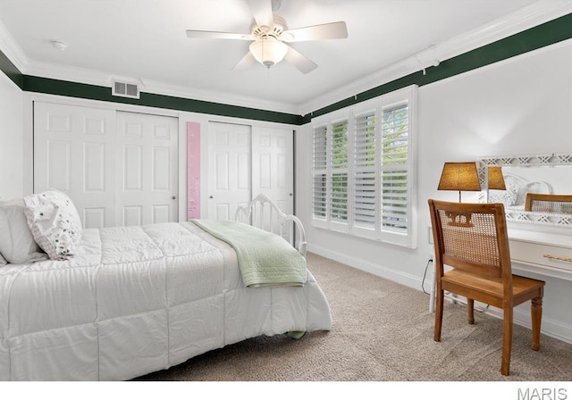 668 Clear Brook Dr, Des Peres, MO 63122 - bedroom featuring carpet, crown molding, multiple closets, baseboards, and ceiling fan