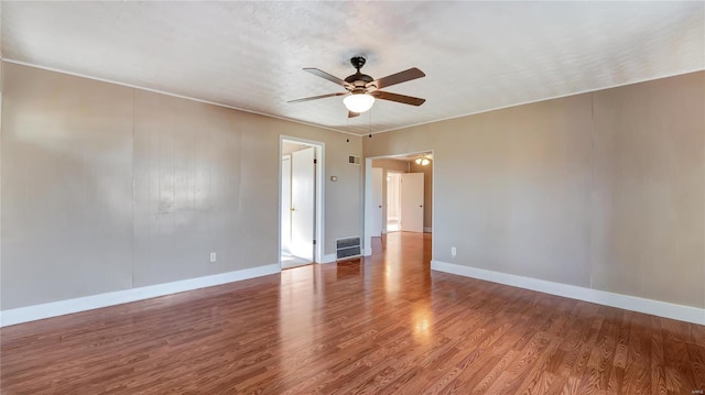 209 W Washington Ave, Richland, MO 65556 - unfurnished room with ceiling fan, wood finished floors, and baseboards