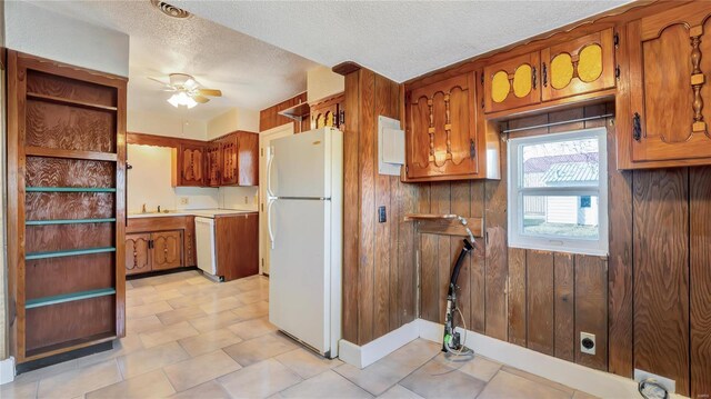 209 W Washington Ave, Richland, MO 65556 - kitchen featuring white appliances, ceiling fan, brown cabinets, open shelves, and a textured ceiling