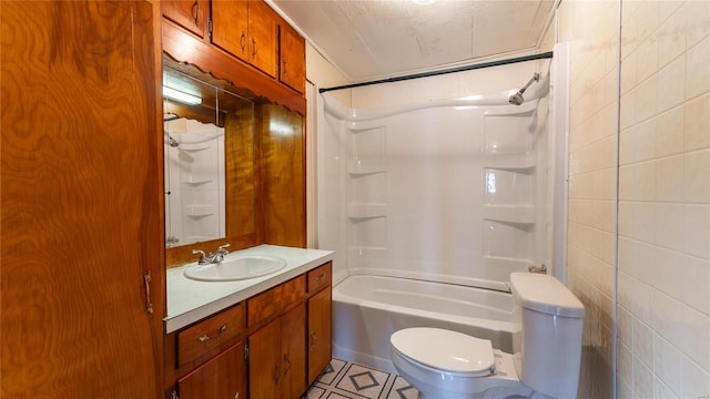 209 W Washington Ave, Richland, MO 65556 - bathroom featuring toilet, shower / tub combination, vanity, tile patterned floors, and tile walls