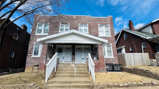 3683 Montana St, Saint Louis, MO 63116 - view of front of home featuring brick siding, fence, and covered porch