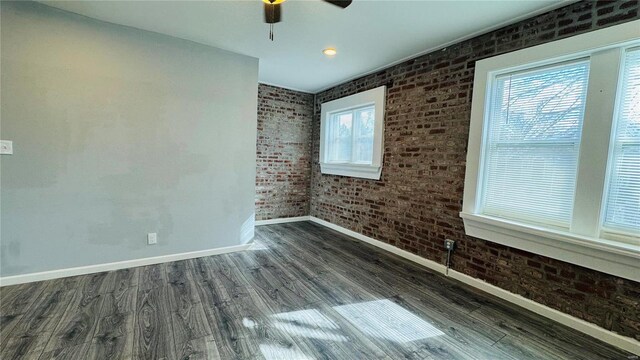 3683 Montana St, Saint Louis, MO 63116 - empty room with baseboards, brick wall, ceiling fan, and dark wood-type flooring
