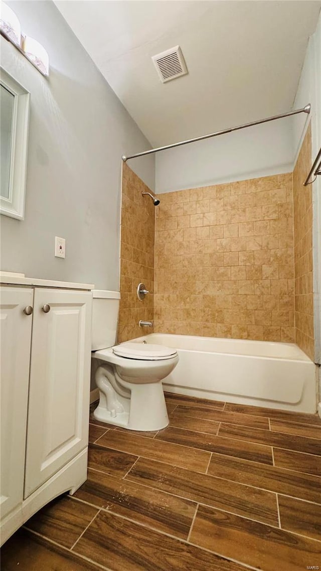 3683 Montana St, Saint Louis, MO 63116 - full bath featuring washtub / shower combination, wood finished floors, and toilet