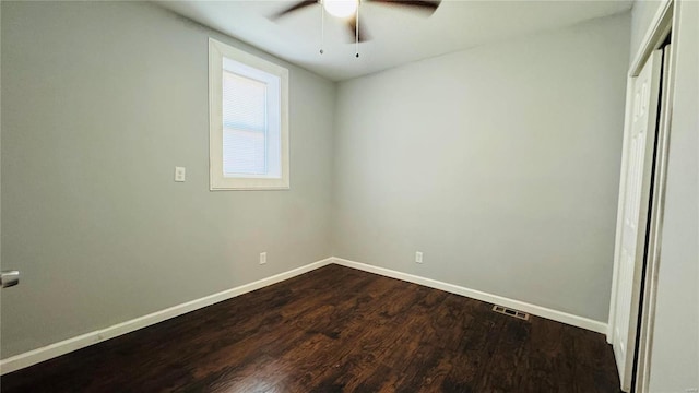 3683 Montana St, Saint Louis, MO 63116 - unfurnished bedroom with dark wood-style flooring, baseboards, a closet, and ceiling fan