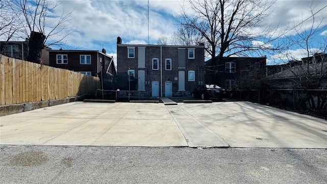 3683 Montana St, Saint Louis, MO 63116 - rear view of house with fence and a trampoline