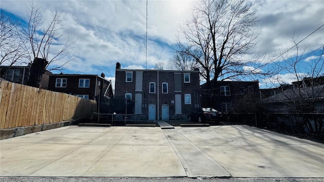 3683 Montana St, Saint Louis, MO 63116 - rear view of property with fence and a trampoline