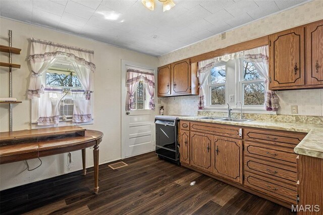 699 Clement Rd, Bloomsdale, MO 63627 - kitchen with a sink, brown cabinets, light countertops, dishwasher, and ornamental molding