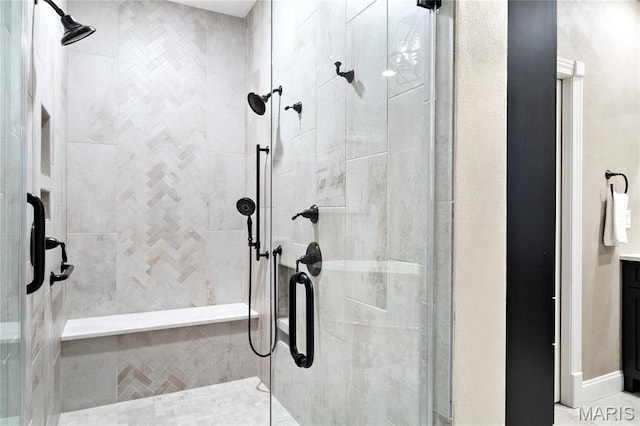 bathroom with a shower stall