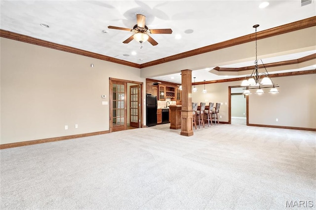 living area with baseboards, crown molding, light colored carpet, decorative columns, and recessed lighting